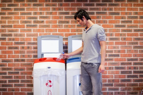 Technician handling electronic waste in Knightsbridge