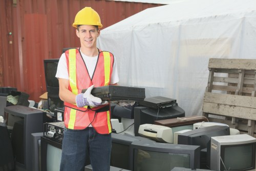 Volunteers loading reusable garden items for charity donation
